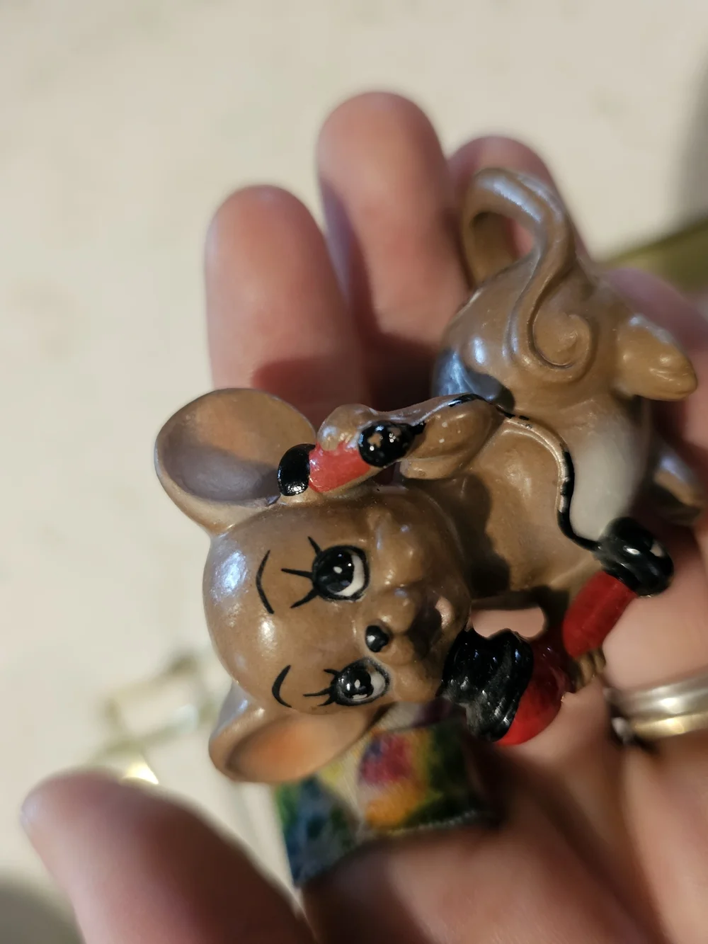 Brown Ceramic Mouse Figurine with Red Phone Decorative Accent